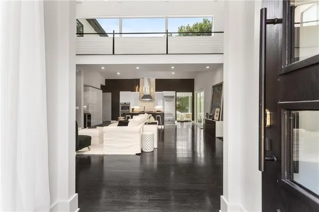 a living room with fireplace furniture and a wooden floor