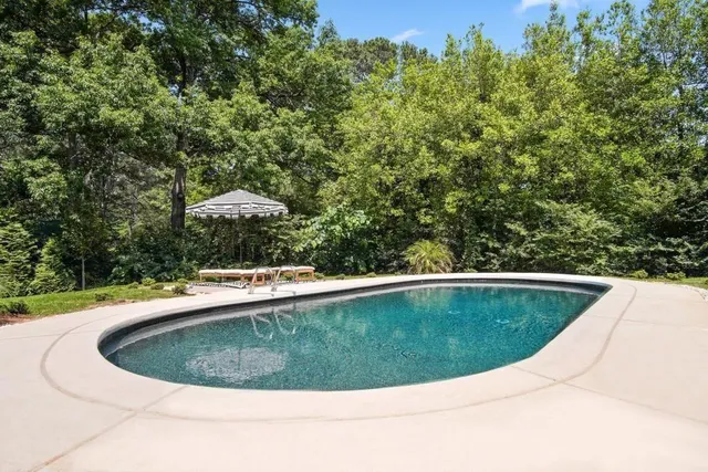 a kitchen with counter top space cabinets and window