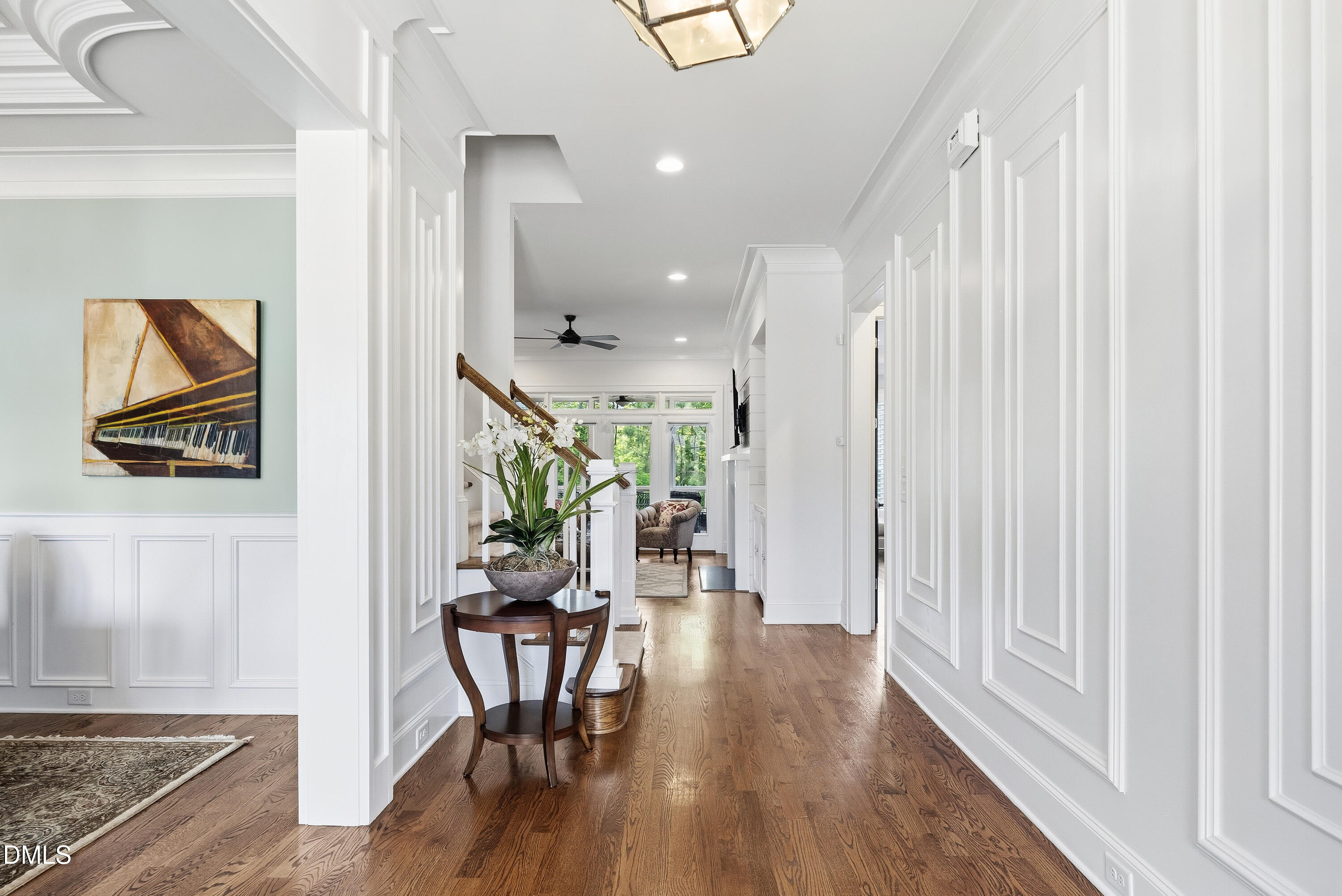 5109 Wainscott Way Raleigh, NC 27612 - Photo 4 of 52 a view of hallway with furniture and wooden floor