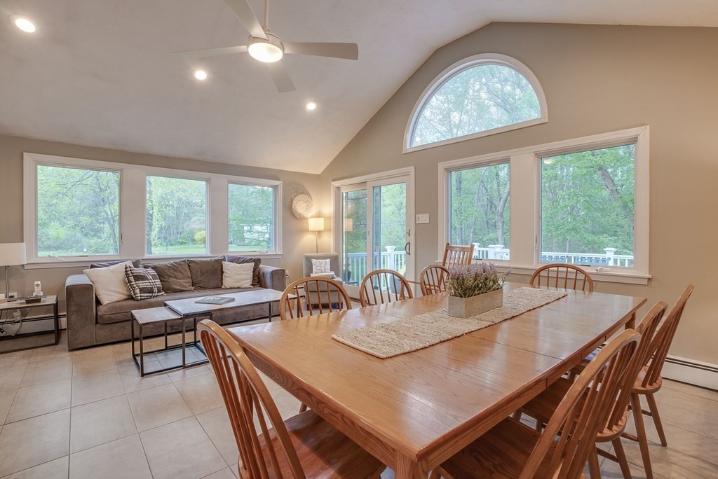 1 Radcliffe Circle Bedford, MA 01730 - Photo 11 of 42 a dining room with furniture a chandelier and wooden floor
