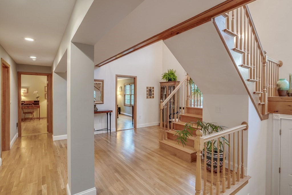 1 Radcliffe Circle Bedford, MA 01730 - Photo 13 of 42 a view of entryway with wooden floor and stairs