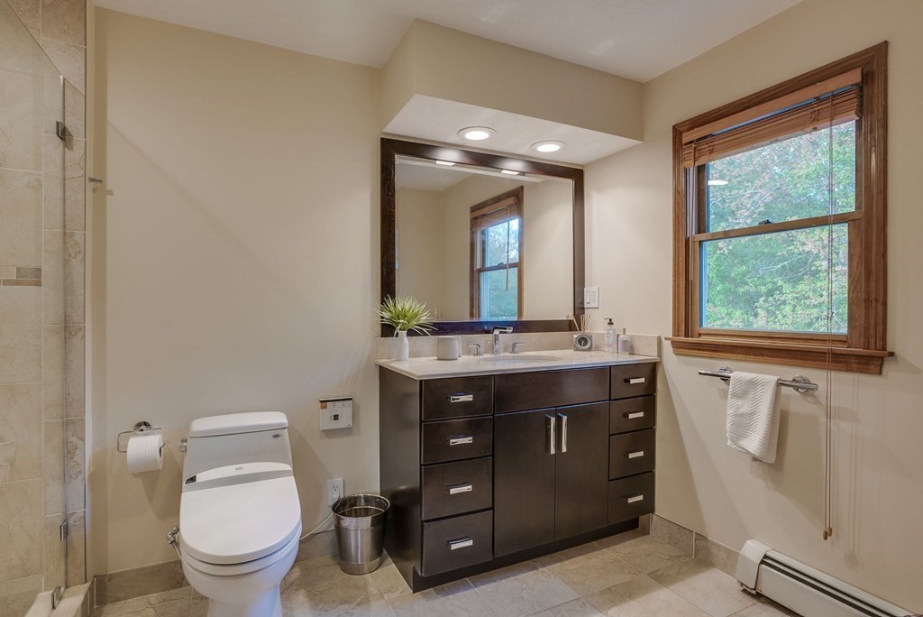1 Radcliffe Circle Bedford, MA 01730 - Photo 20 of 42 a bathroom with a toilet a sink and mirror