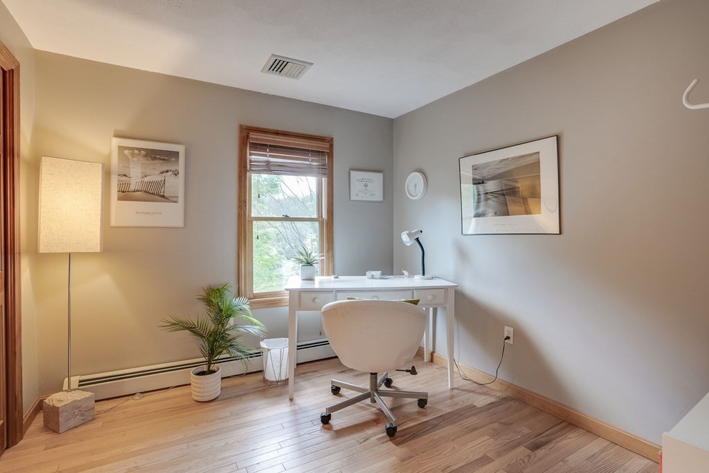 1 Radcliffe Circle Bedford, MA 01730 - Photo 24 of 42 a view of a workspace with furniture and a window