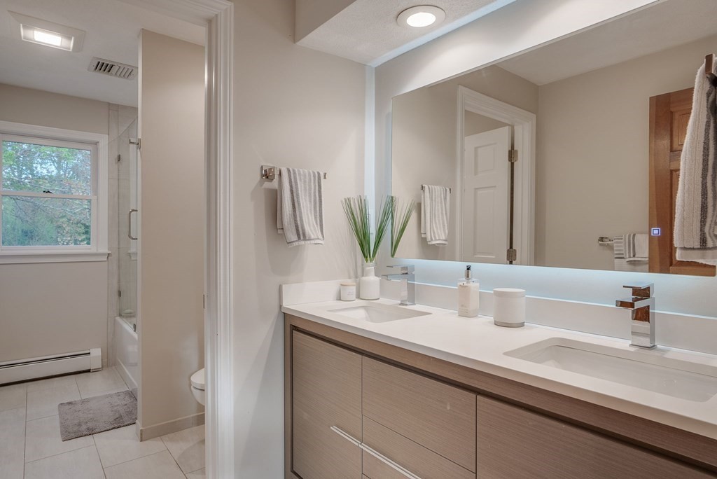 1 Radcliffe Circle Bedford, MA 01730 - Photo 27 of 42 a bathroom with a sink and a mirror