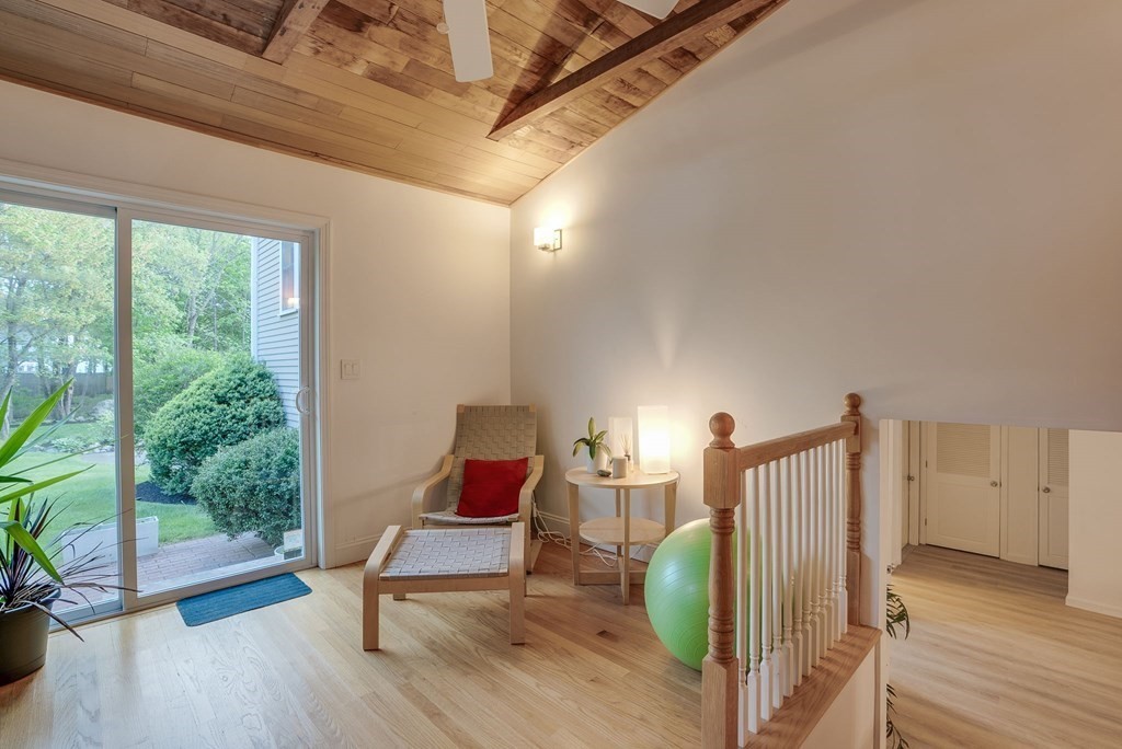 1 Radcliffe Circle Bedford, MA 01730 - Photo 29 of 42 a view of a livingroom with wooden floor and chair