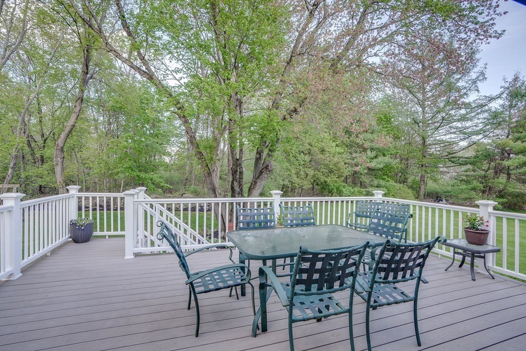 1 Radcliffe Circle Bedford, MA 01730 - Photo 30 of 42 a view of a chair and table on the deck