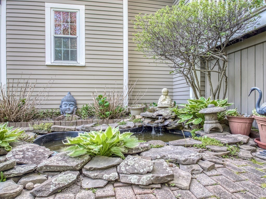1 Radcliffe Circle Bedford, MA 01730 - Photo 33 of 42 a potted plant sitting in front of a house