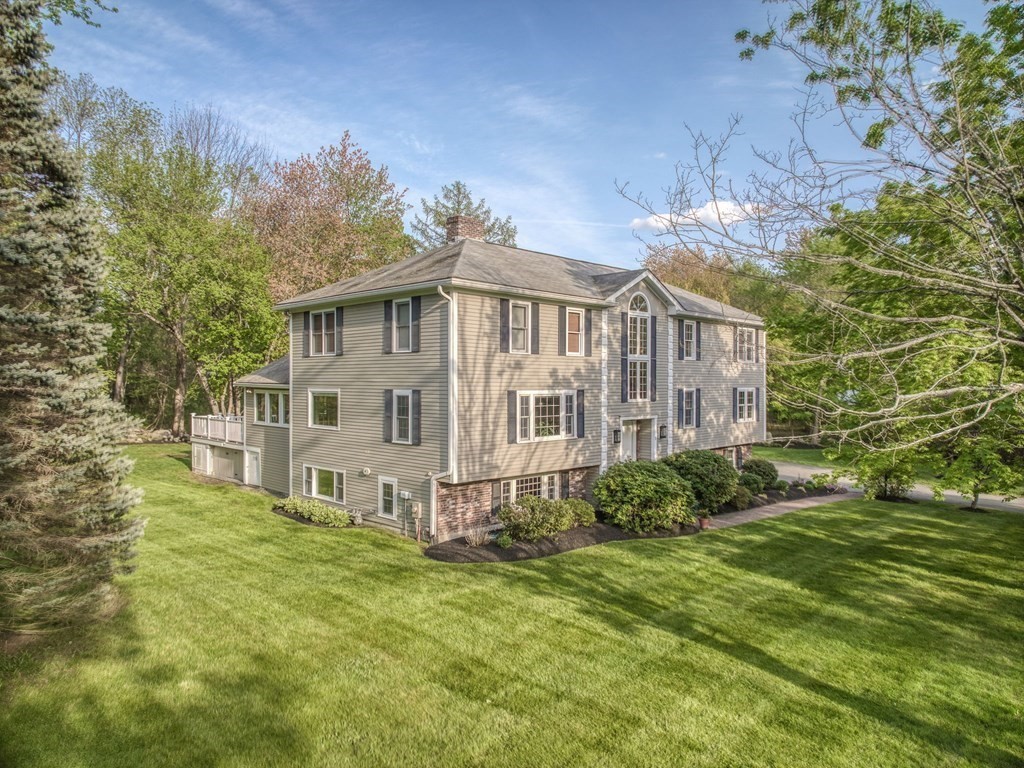 1 Radcliffe Circle Bedford, MA 01730 - Photo 36 of 42 a view of a house with a big yard and large trees