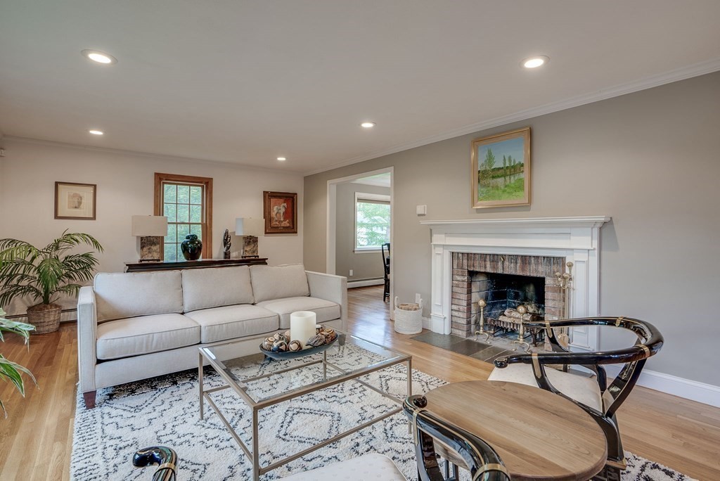 1 Radcliffe Circle Bedford, MA 01730 - Photo 8 of 42 a living room with furniture and a fireplace