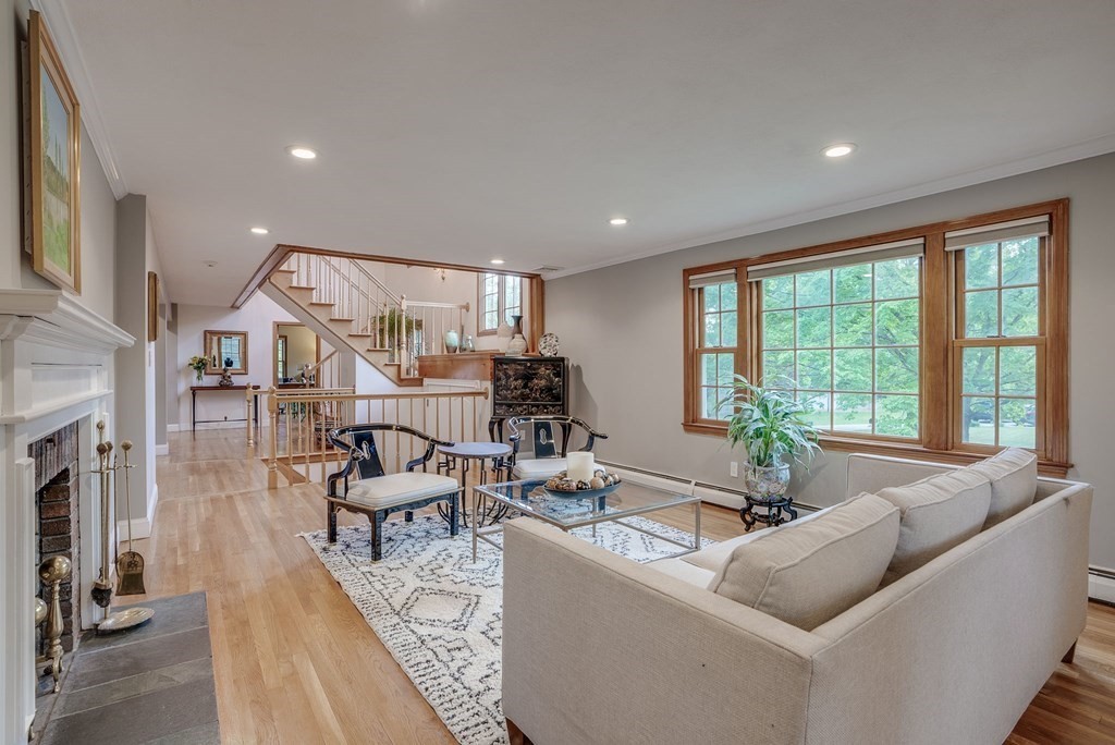 1 Radcliffe Circle Bedford, MA 01730 - Photo 9 of 42 a living room with fireplace furniture and a large window