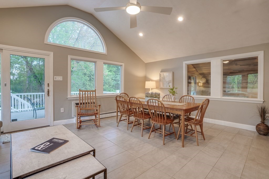 1 Radcliffe Circle Bedford, MA 01730 - Photo 10 of 42 a dining room with furniture a chandelier and wooden floor
