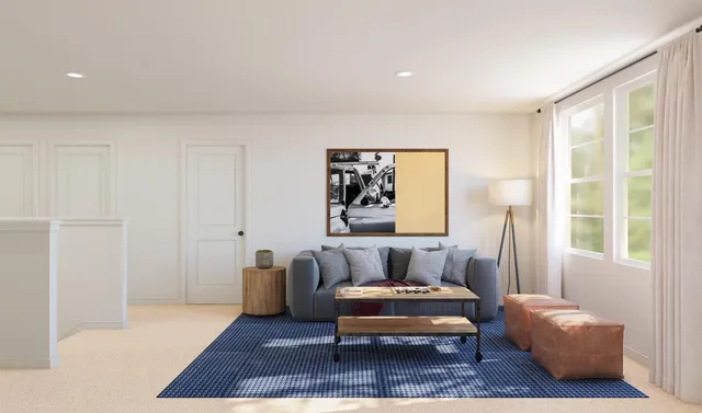 a view of a bedroom with furniture and windows