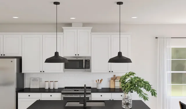 a view of a dining room with furniture and a potted plant