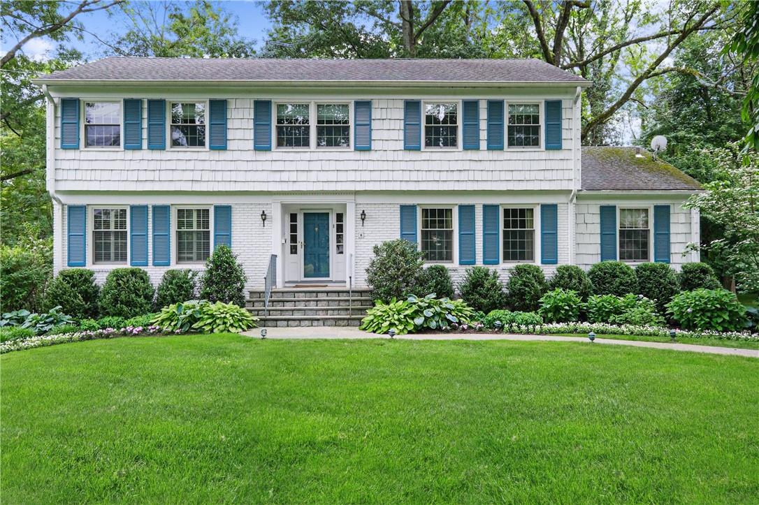 Classic center hall Colonial in Heathcote on a park-like half acre of level property.
