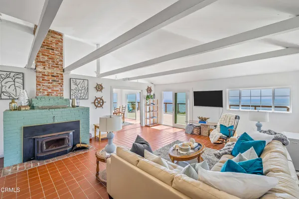 a view of a dining room with furniture water view and balcony