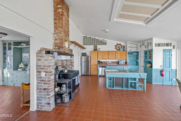 a spacious bedroom with a bed and a large window