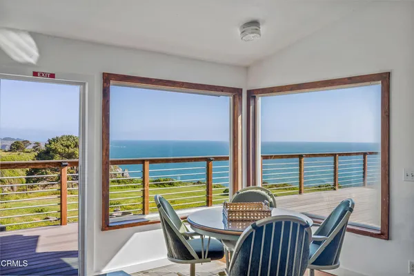 a view of a balcony with chairs