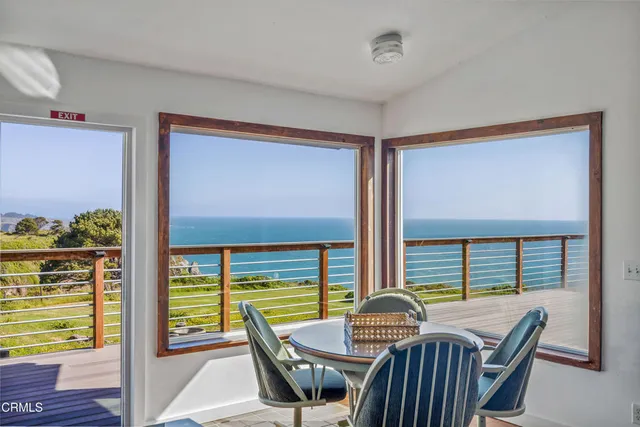 a view of a balcony with chairs