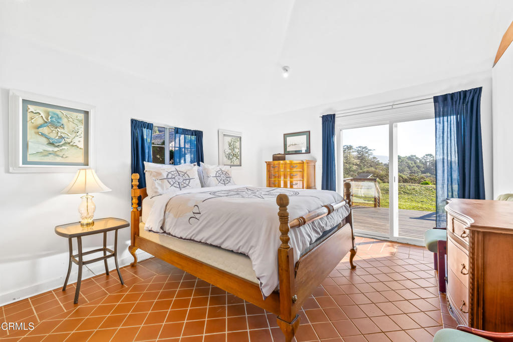 1990 Highway 1 Albion, CA 95410 - Photo 28 of 57 a spacious bedroom with a bed and a large window