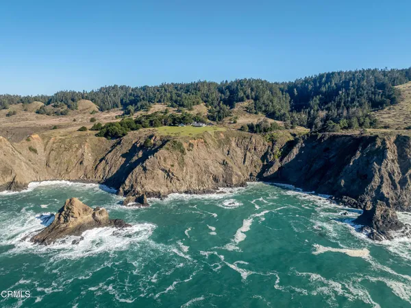 a view of a field with an houses