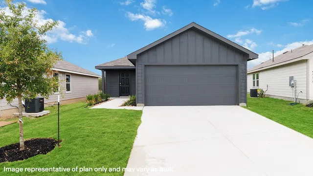 a front view of house with yard and green space