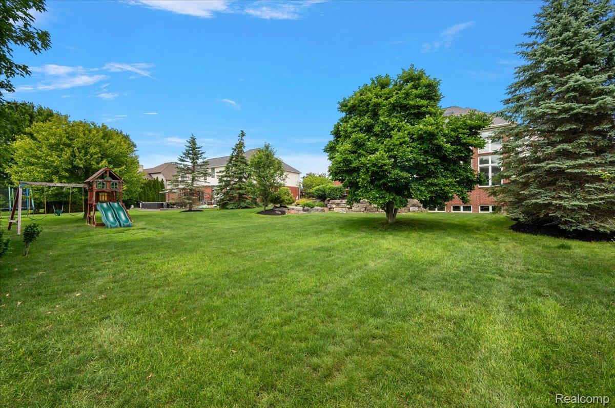 1422 Galena Rochester, MI 48306 - Photo 69 of 73 Expansive green lawn providing ample space for outdoor activities