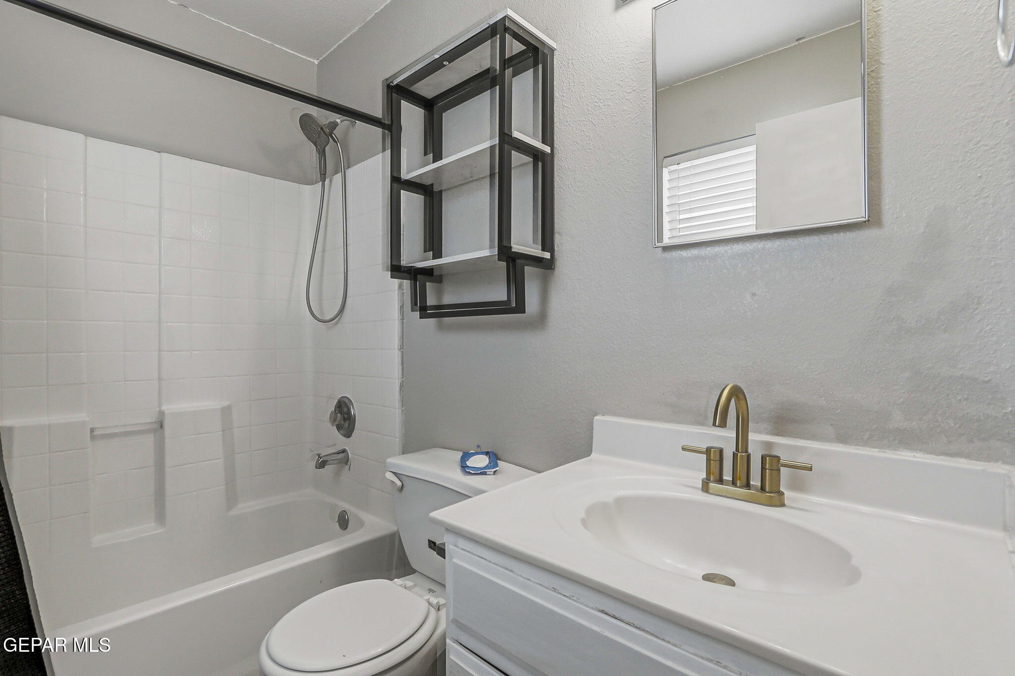 3424 Tierra Cromo Road El Paso, TX 79938 - Photo 16 of 27 a bathroom with a sink toilet and shower