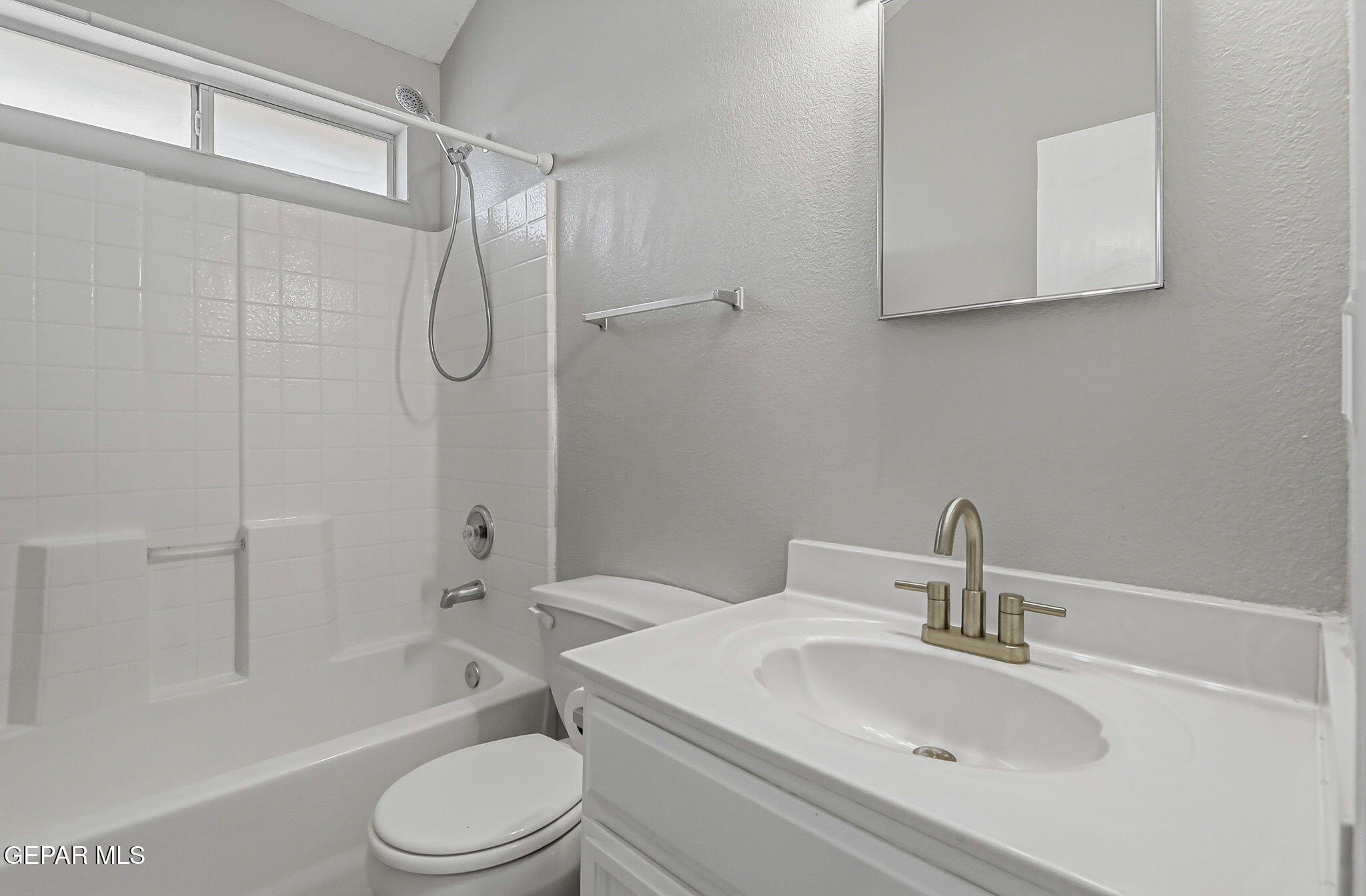 3424 Tierra Cromo Road El Paso, TX 79938 - Photo 19 of 27 a bathroom with a toilet sink vanity tub and shower