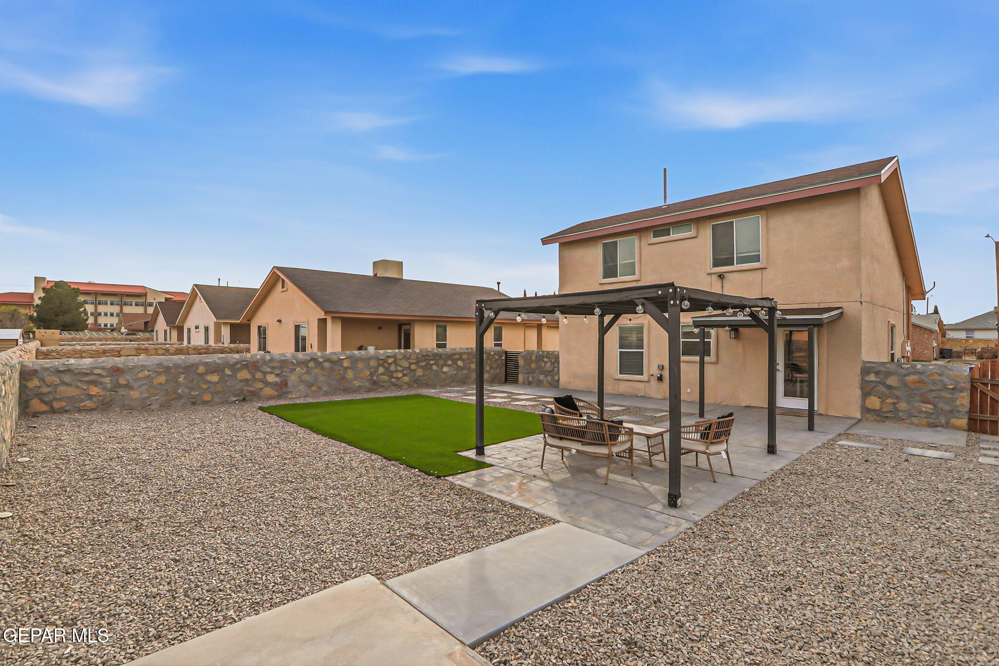3424 Tierra Cromo Road El Paso, TX 79938 - Photo 26 of 27 a front view of a house with garden