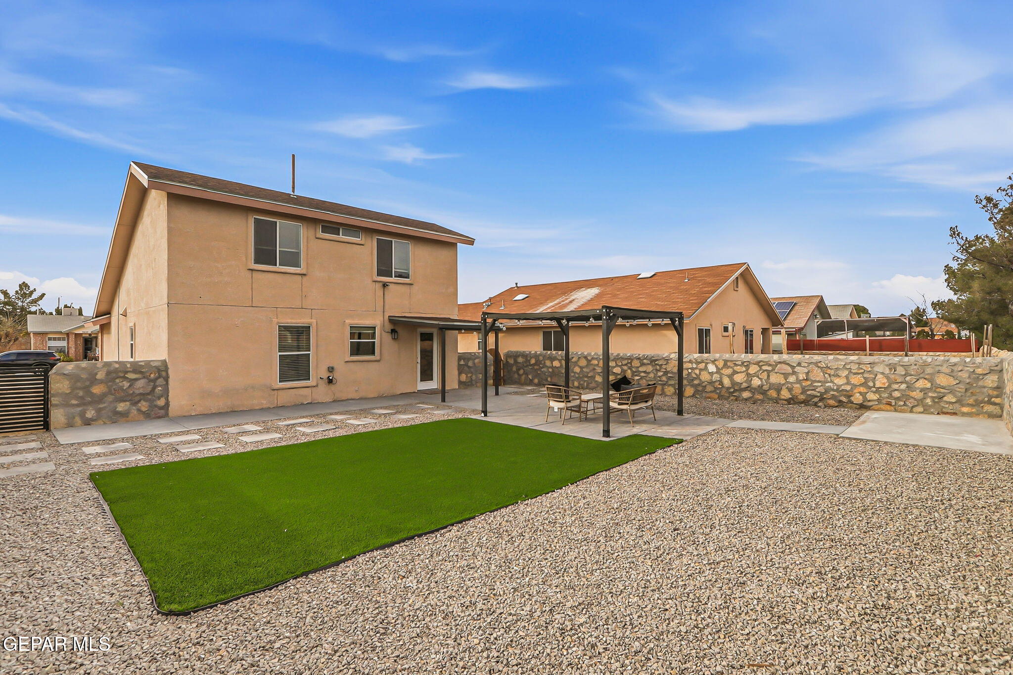 3424 Tierra Cromo Road El Paso, TX 79938 - Photo 27 of 27 a view of a house with a yard and sitting area