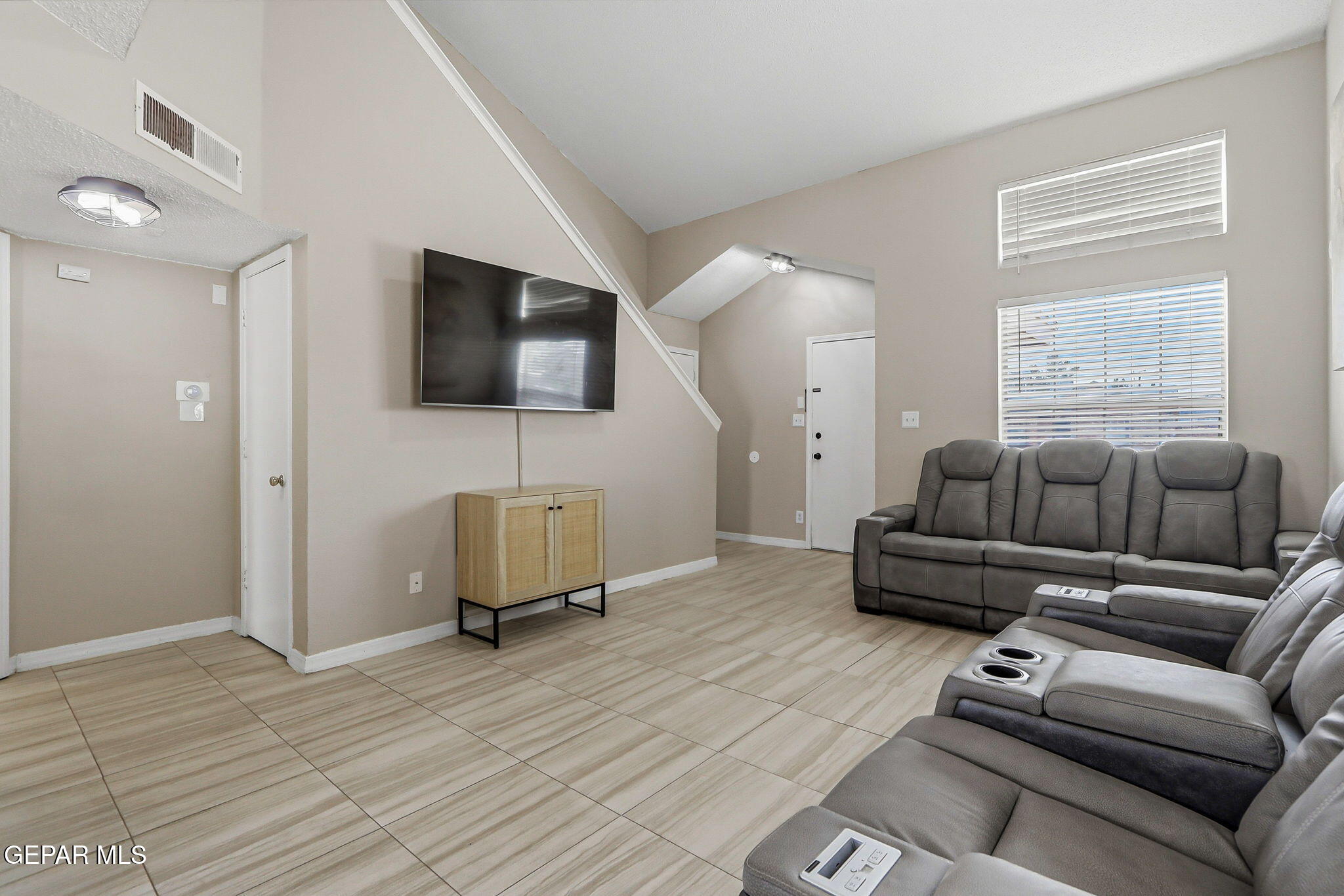 3424 Tierra Cromo Road El Paso, TX 79938 - Photo 6 of 27 a living room with furniture and a flat screen tv