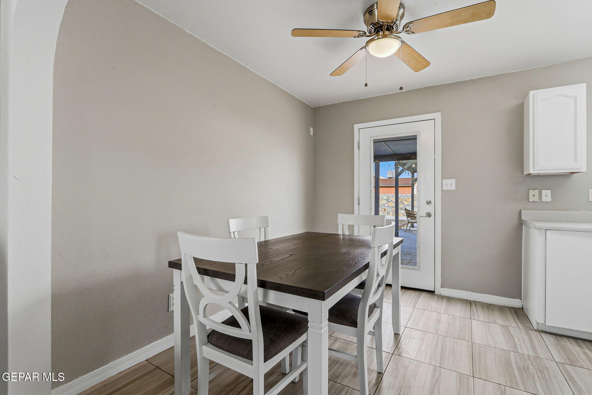 3424 Tierra Cromo Road El Paso, TX 79938 - Photo 8 of 27 a view of a dining room with furniture and a chandelier fan