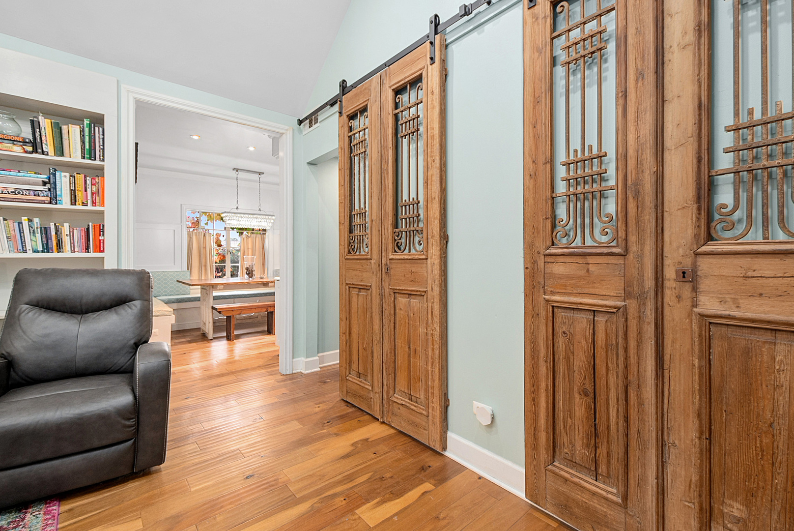 701 East 7th Street Lockport, IL 60441 - Photo 14 of 29 a living room with furniture a bookshelf and wooden floor