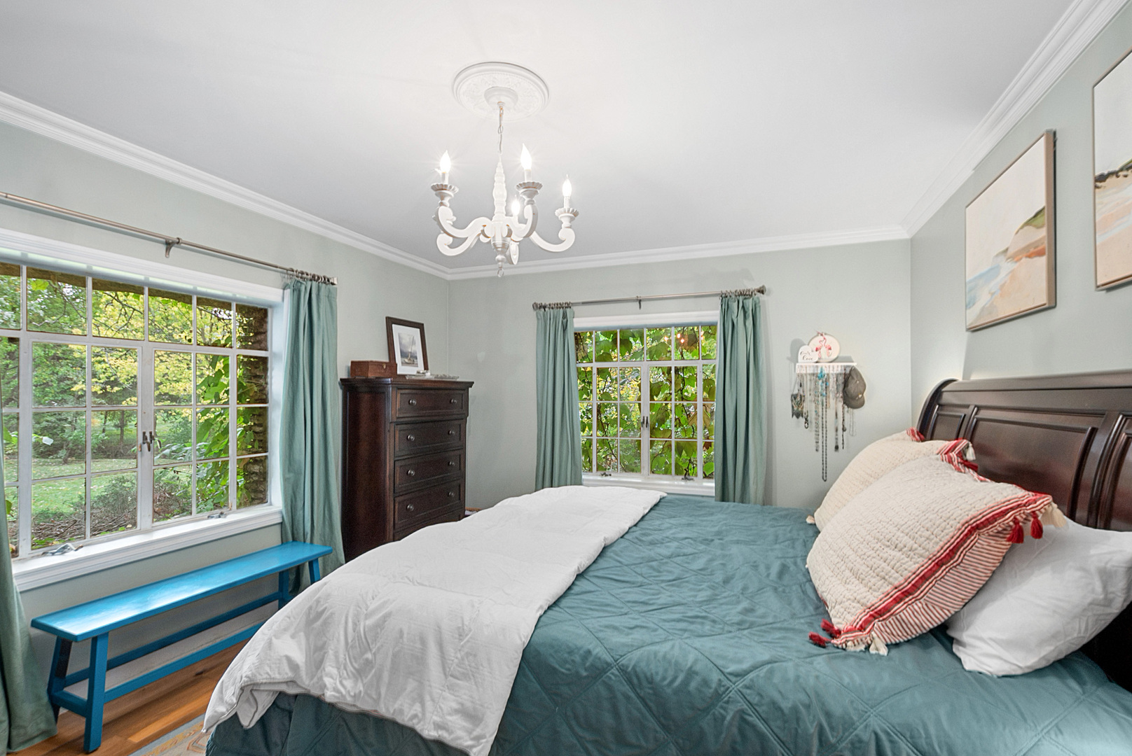 701 East 7th Street Lockport, IL 60441 - Photo 15 of 29 a bedroom with a large bed and a chandelier