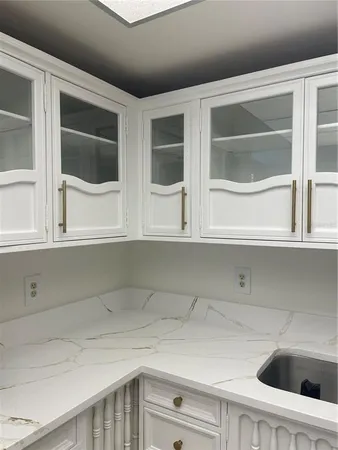 a stove top oven sitting inside of a kitchen