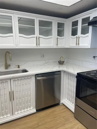 a refrigerator freezer sitting inside of a kitchen