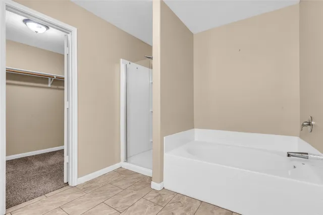 a white bath tub sitting in a bathroom