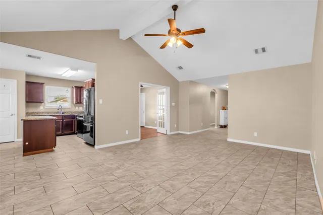 a view of a livingroom with a kitchen