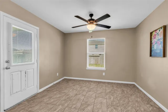 a view of an empty room with a window