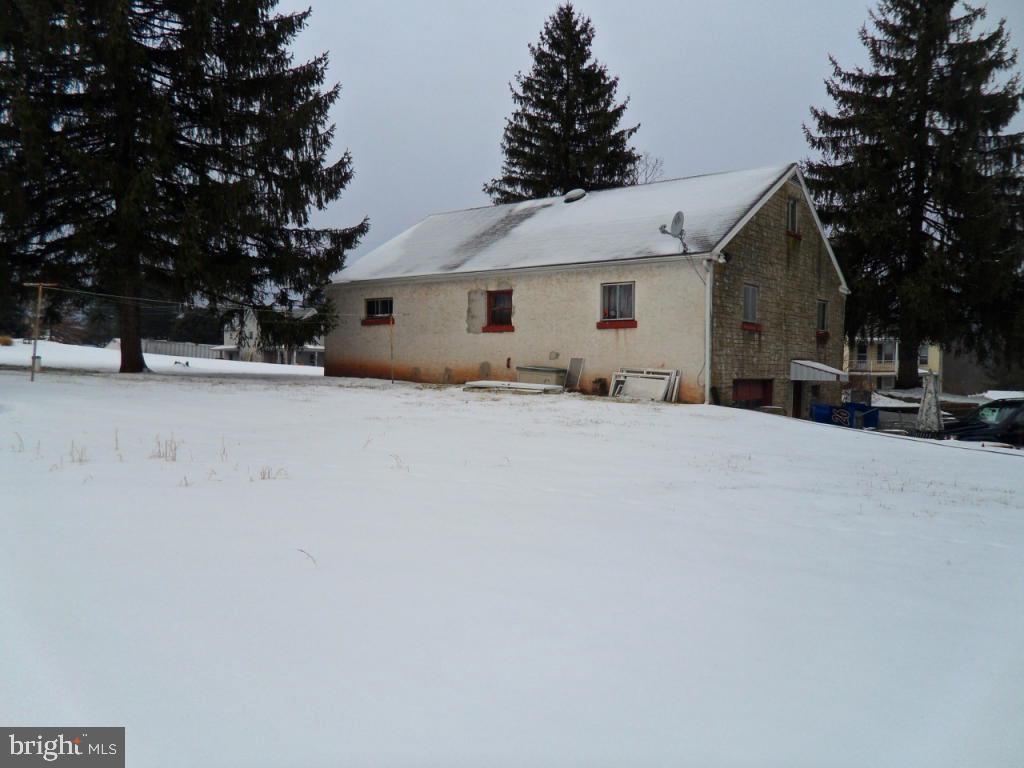 748 Hopeland Road Lititz, PA 17543 - Photo 23 of 26 a view of a house with a snow in the yard