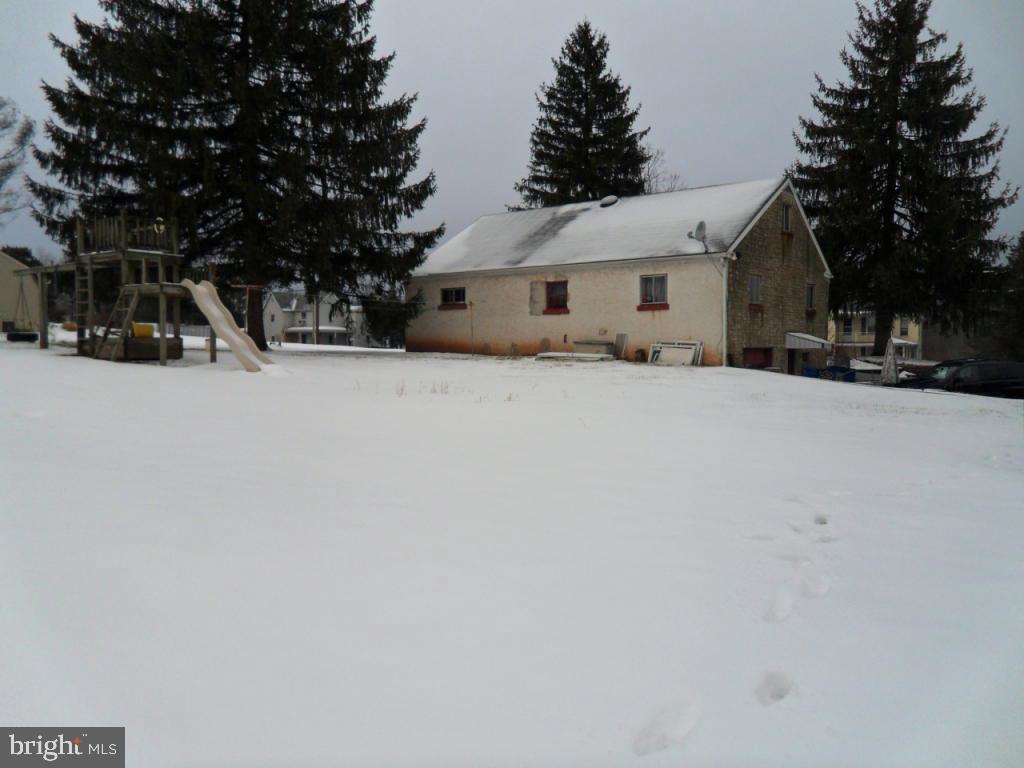748 Hopeland Road Lititz, PA 17543 - Photo 24 of 26 a front view of a house with a yard covered with snow