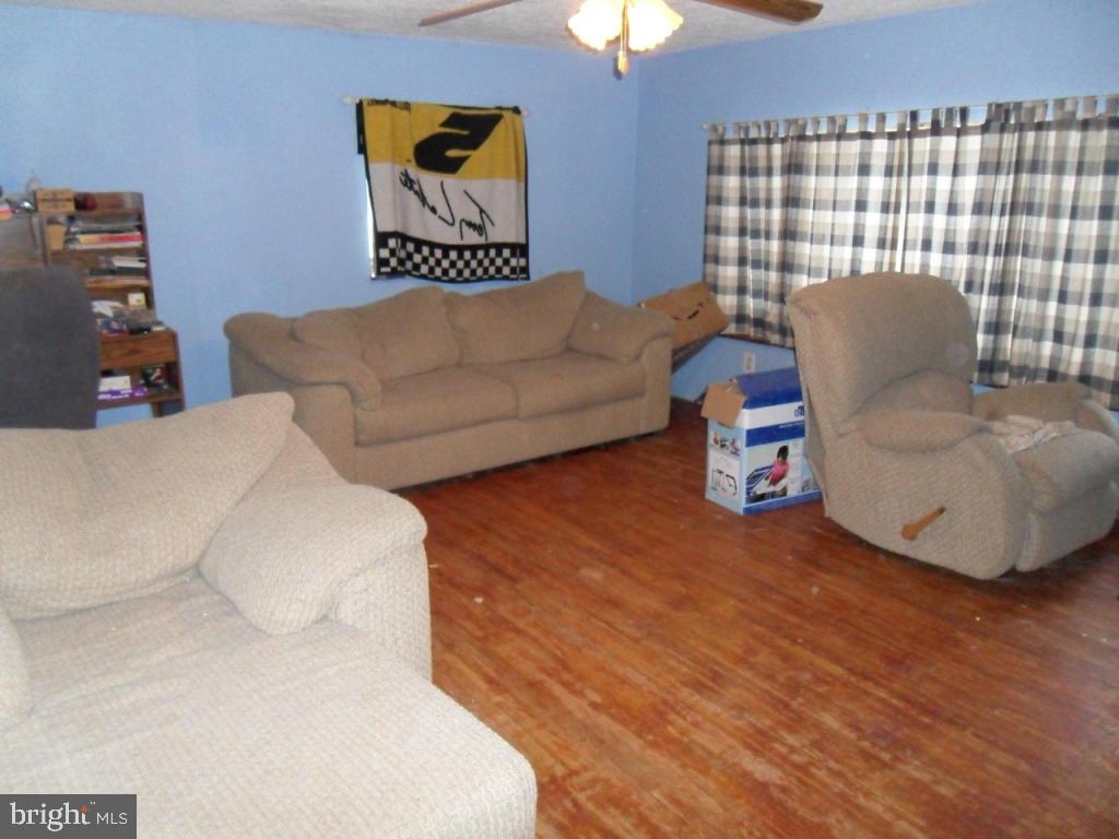 748 Hopeland Road Lititz, PA 17543 - Photo 5 of 26 a living room with furniture and a flat screen tv