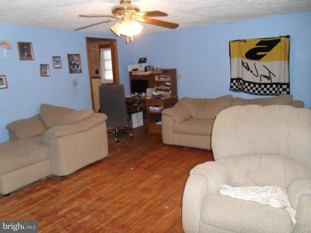 748 Hopeland Road Lititz, PA 17543 - Photo 6 of 26 a living room with furniture and a flat screen tv