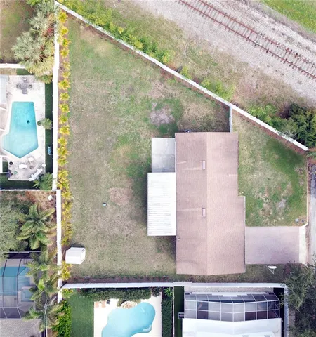 a kitchen with stainless steel appliances a refrigerator sink and white cabinets