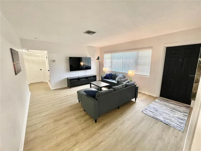 a kitchen with stainless steel appliances a refrigerator stove and microwave