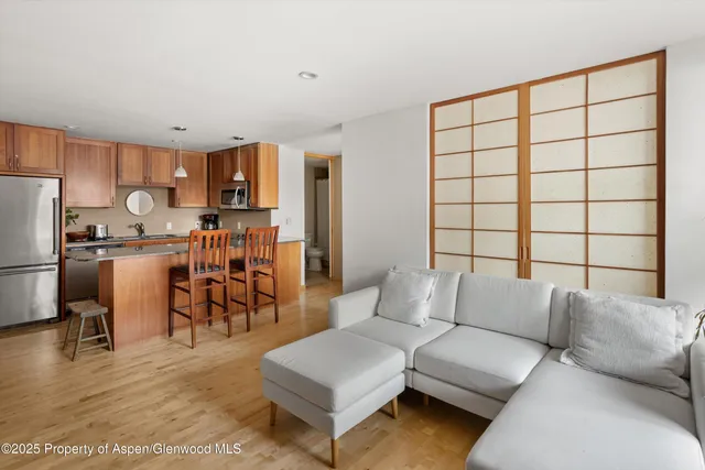 a living room with furniture and a table