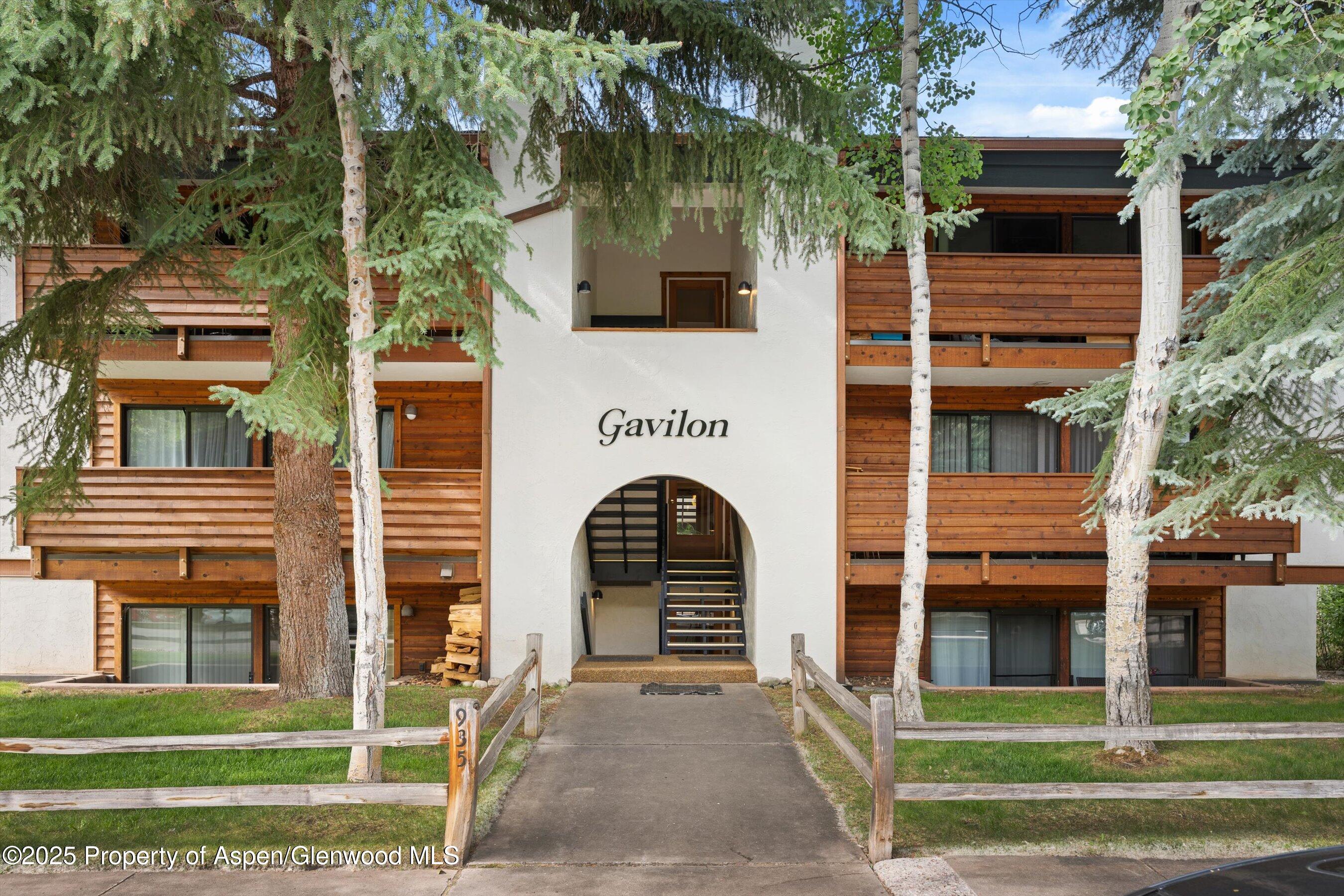 935 East Hopkins Avenue, Unit 7 Aspen, CO 81611 - Photo 3 of 17 a view of a building with a door and a large tree