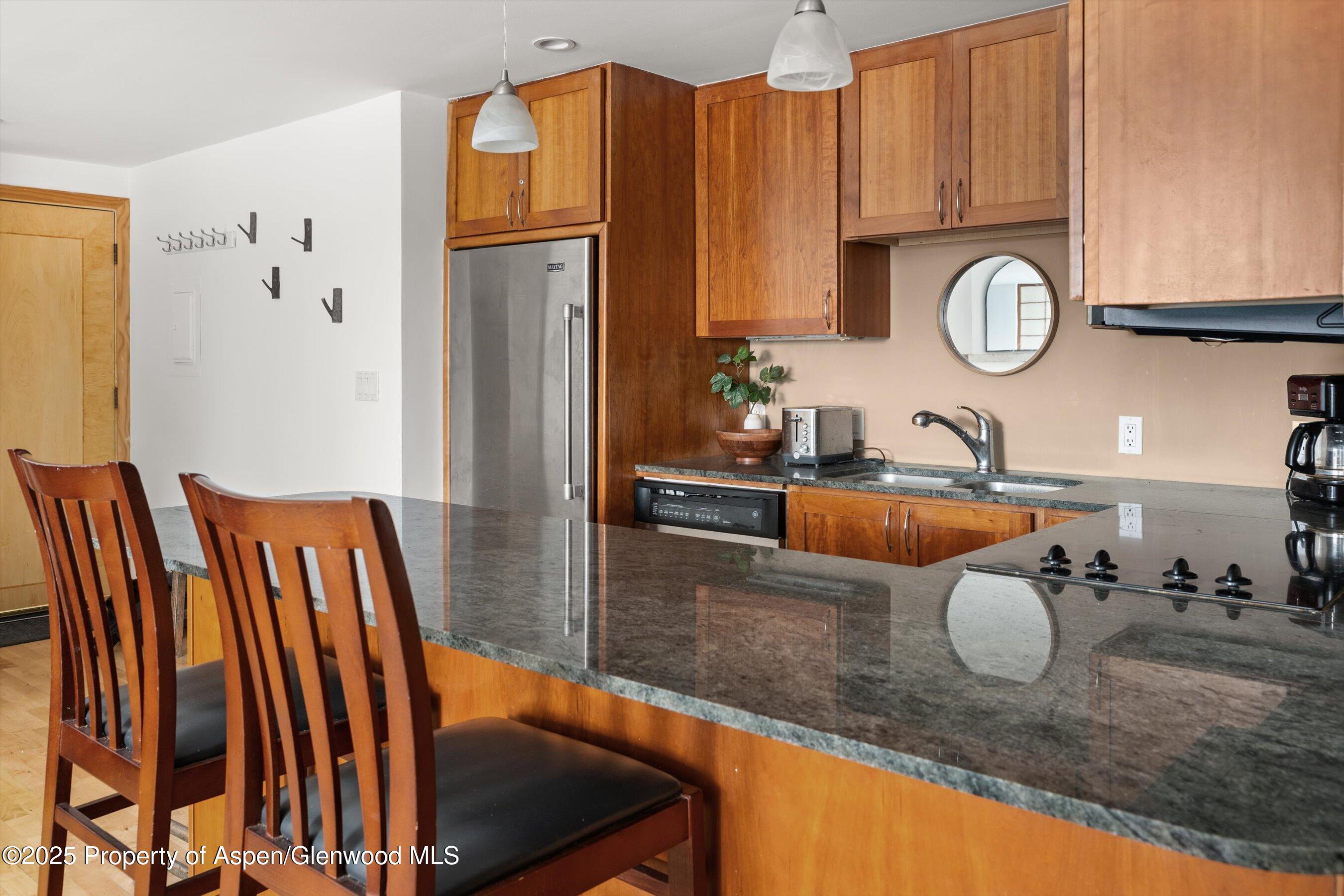 935 East Hopkins Avenue, Unit 7 Aspen, CO 81611 - Photo 10 of 17 a bathroom with a sink and a mirror