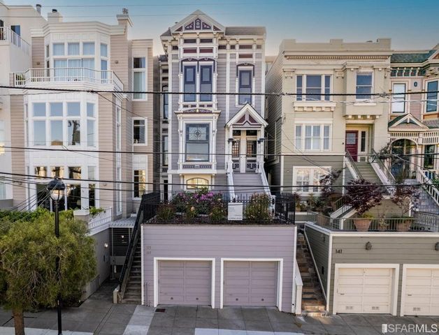 a living room with furniture a fireplace and a table