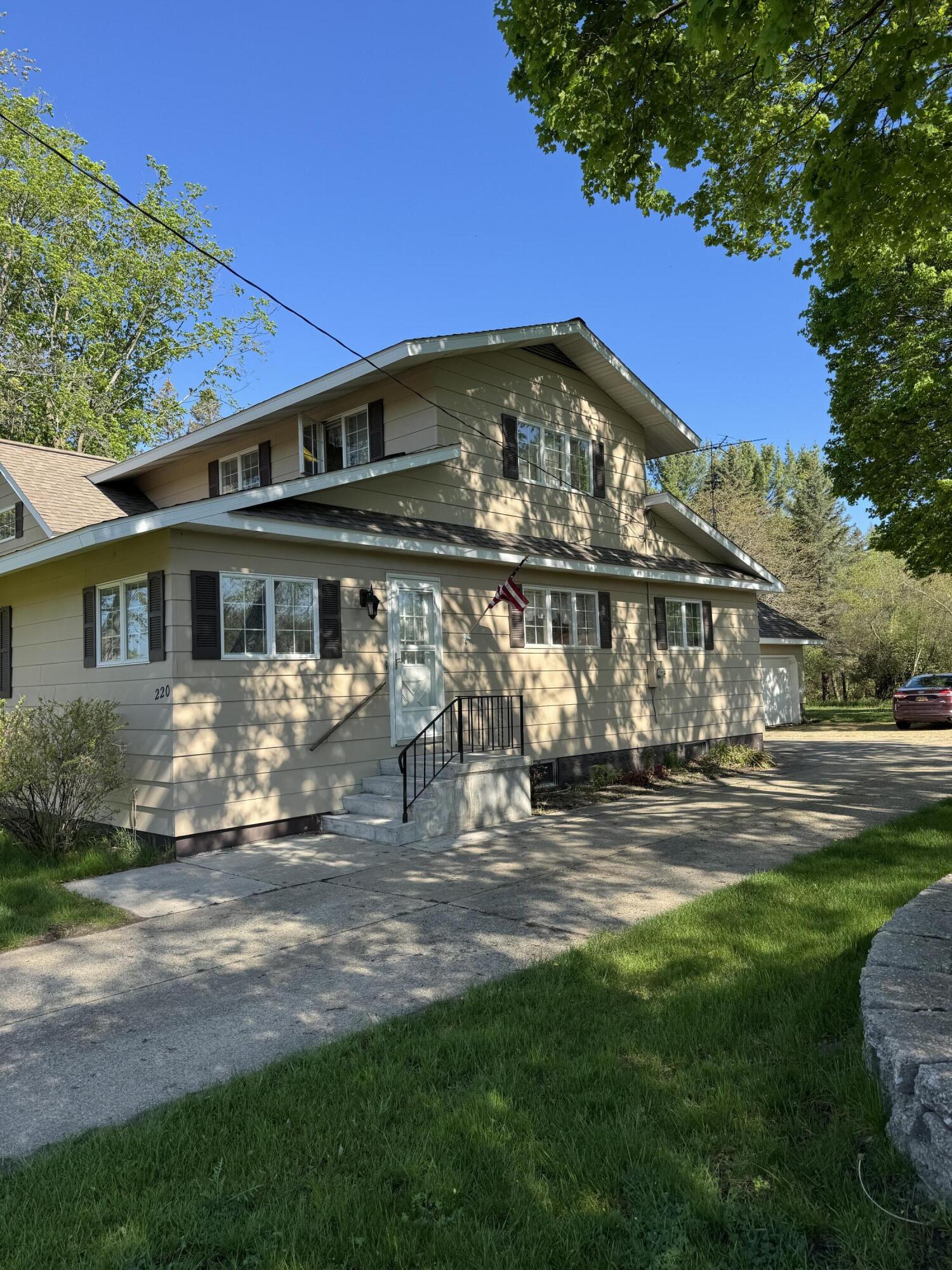 220 East Preuss Road Manistee, MI 49660 - Photo 2 of 28 East Side & Driveway